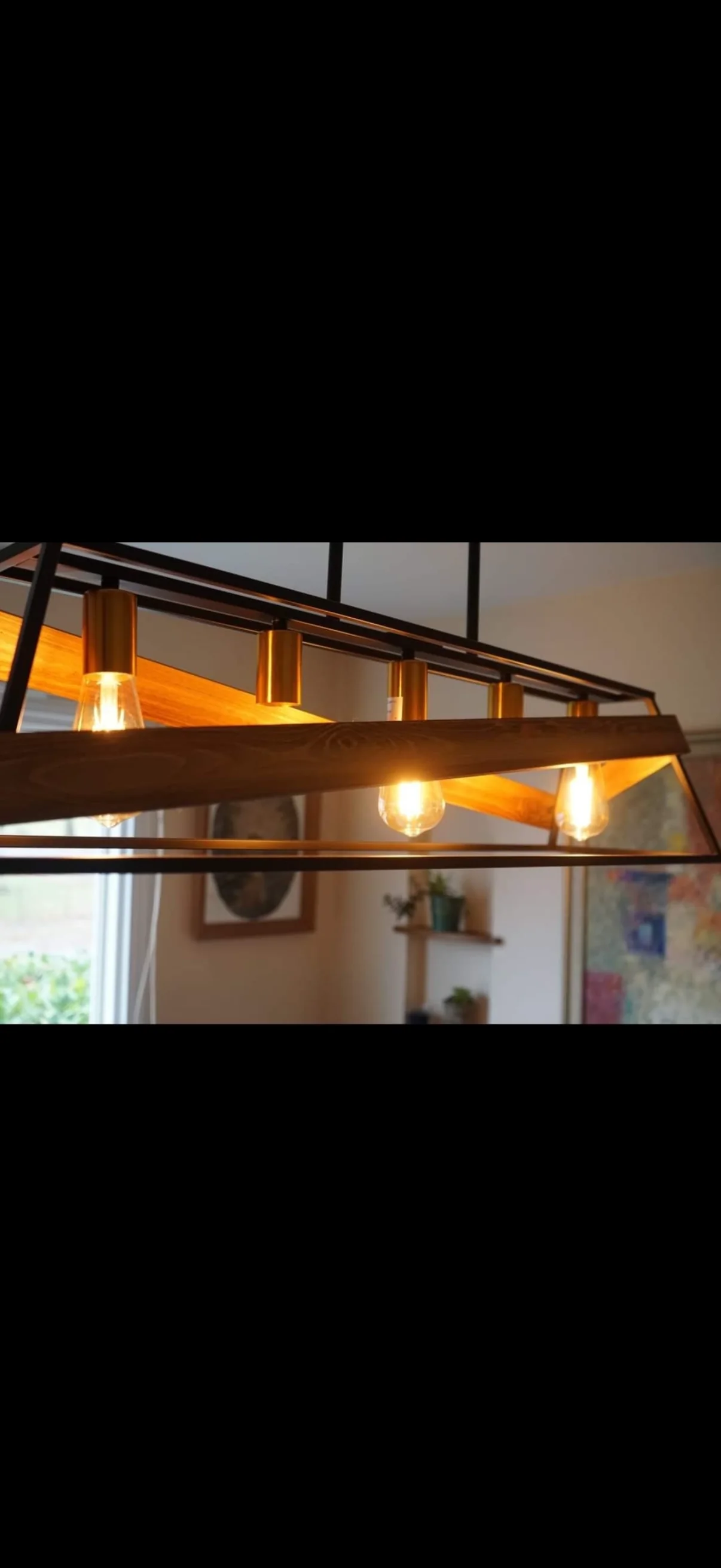 Decorative pendant lighting. Warm pendant lighting with wood and metal detailing.