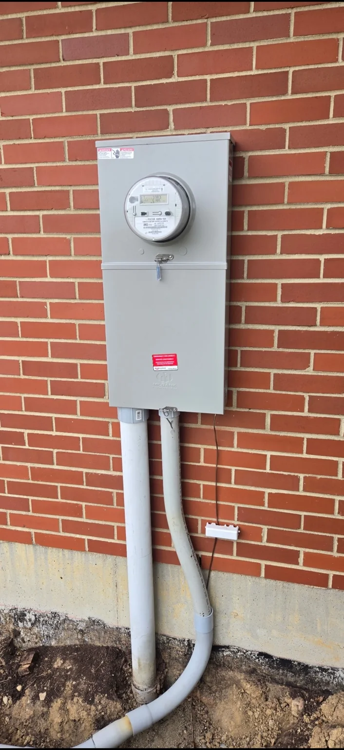 Exterior service equipment. Meter and service equipment mounted on an exterior wall.