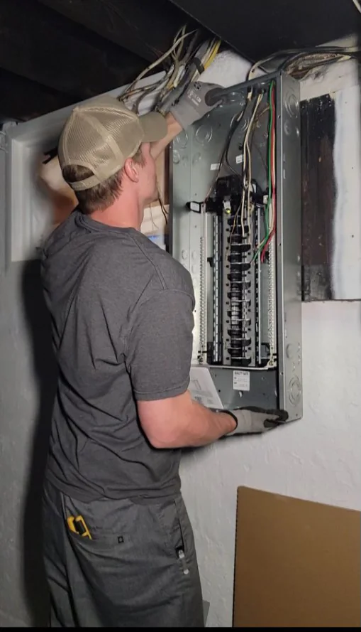 Lytle electrician working at an electrical panel