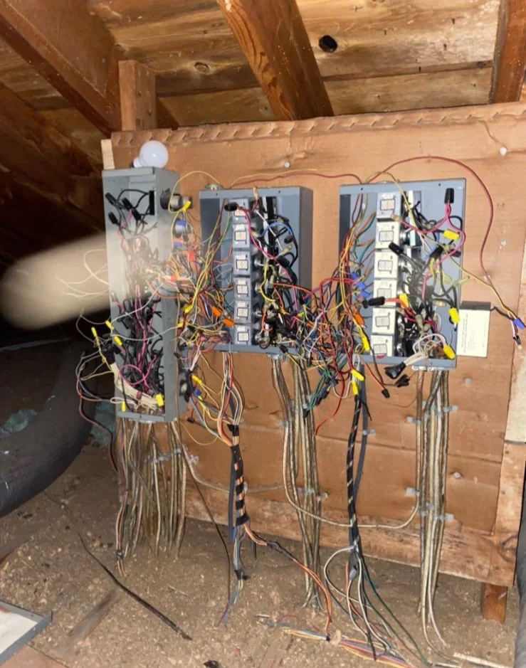 Lighting controls during work. Control wiring photographed with the covers removed.