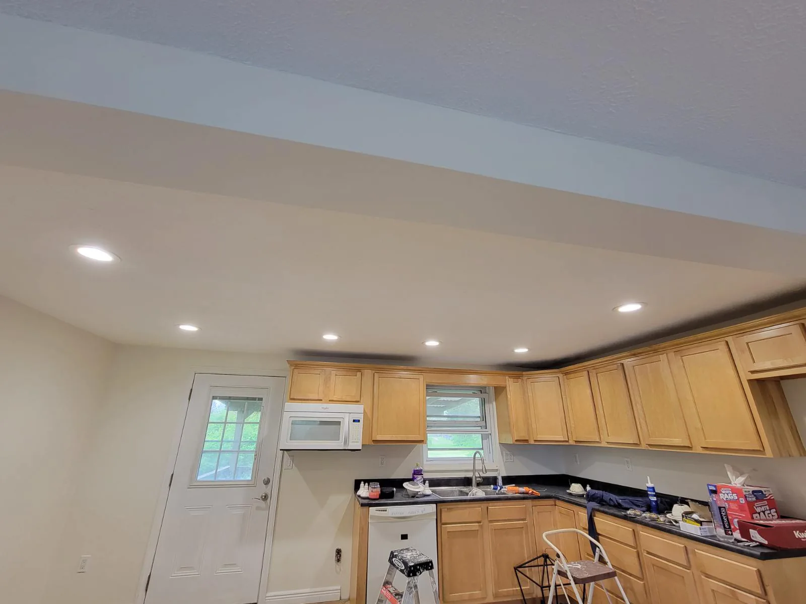 Recessed lighting installation. Kitchen lighting photographed during the project.